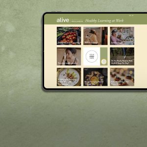 Tablet showing alive Workplace Wellness page with featured corporate wellness articles.